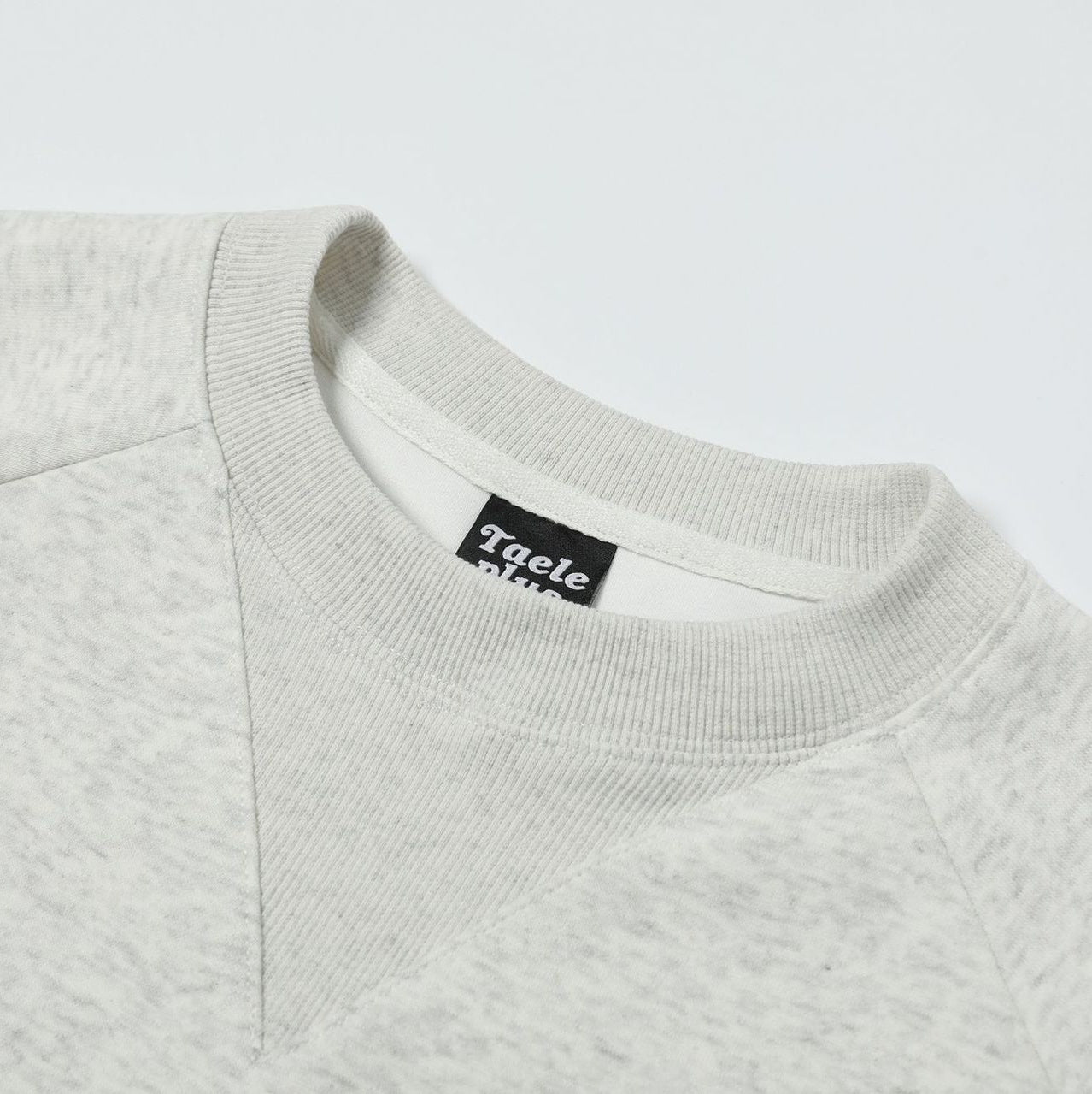 Embroidered round neck hoodie with adhesive fabric